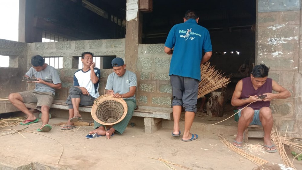 Young men learning to weave baskets at one of the Thehou in Khonoma village. (Morung Photo)